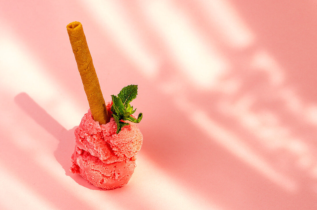 Strawberry ice cream scoops with waffle stick