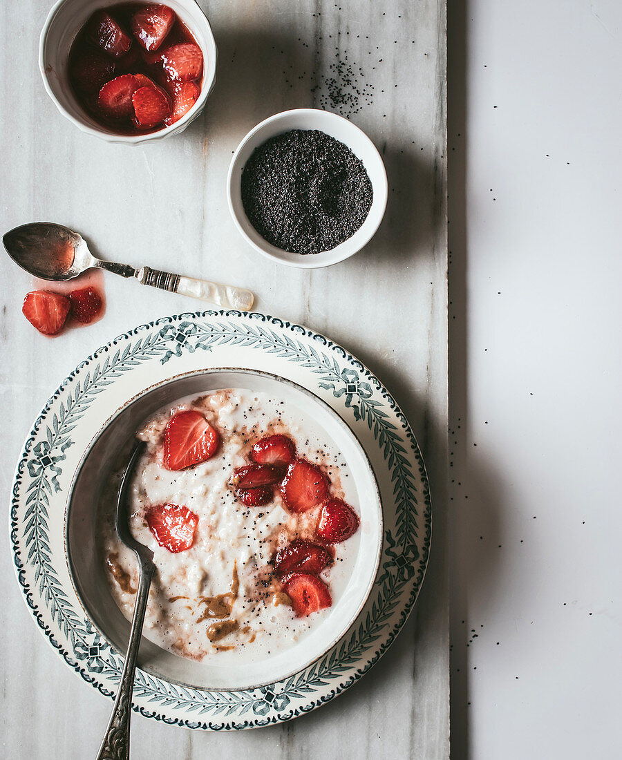 From above served oatmeal with strawberry and chia seeds