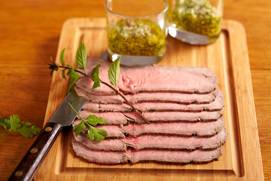 Cold sliced roast beef with salsa verde