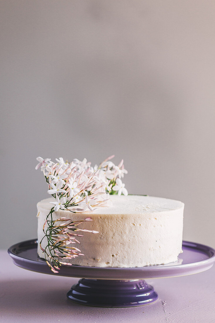 Vanilla buttercream cake decorated with flowers