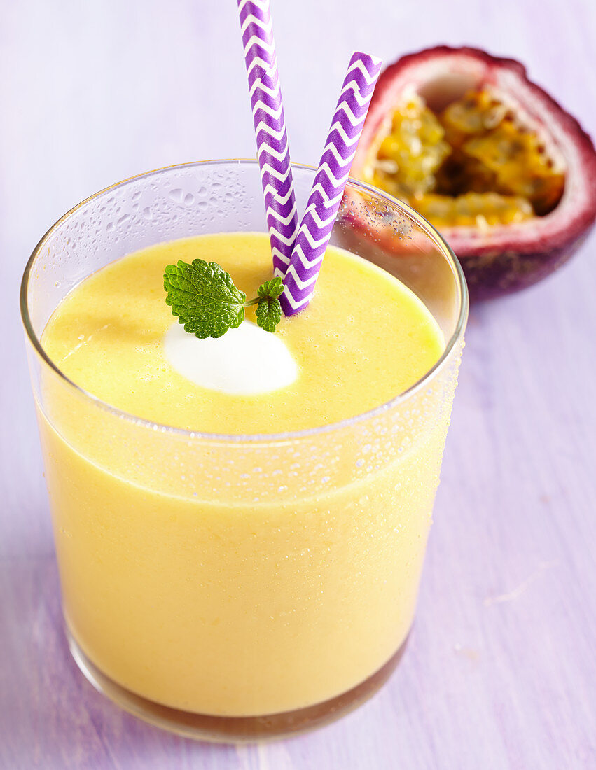 A mango and passion fruit smoothie with yoghurt, orange juice and honey