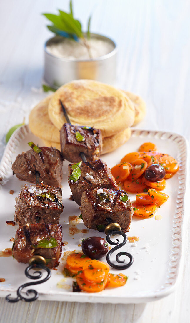 Espetada madeirense: beef skewers with sweet potato bread and Portuguese carrot salad