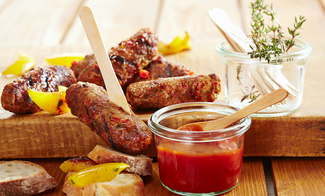 Grilled minced meat sausages with homemade BBQ sauce