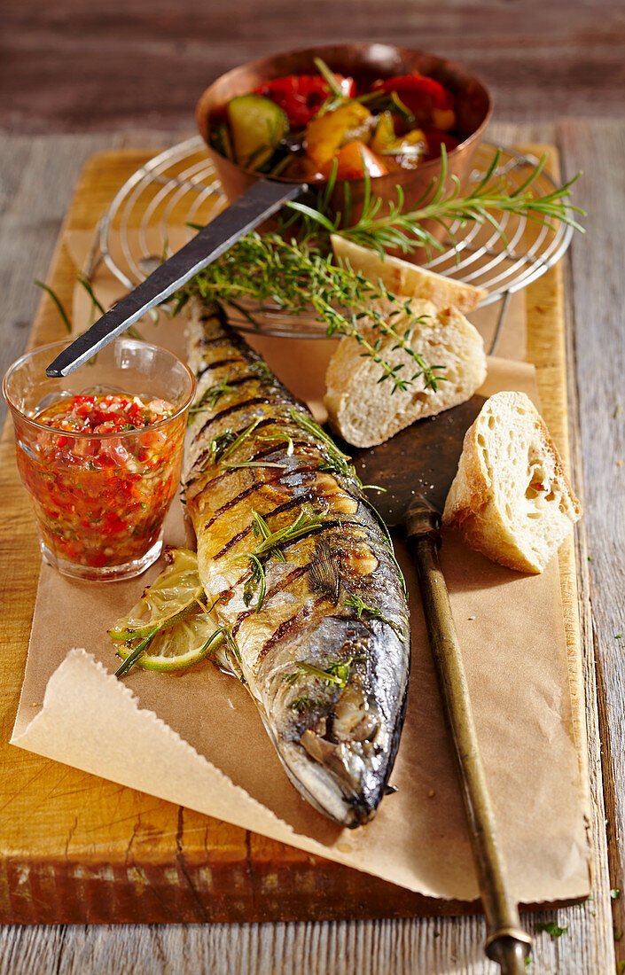 Whole grilled herb mackerel with red salsa, grilled vegetables and white bread