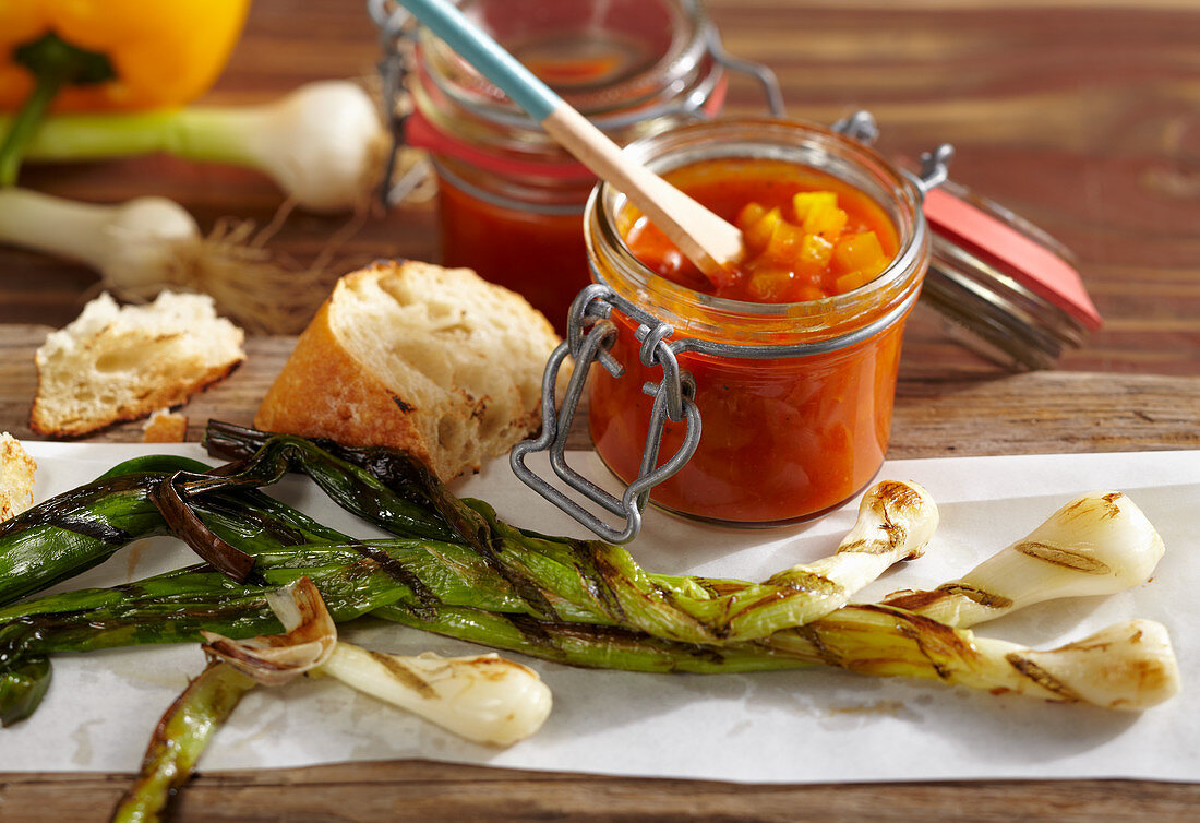 Calcotada a la riba: grilled spring onions with a pepper and wine sauce and baguette
