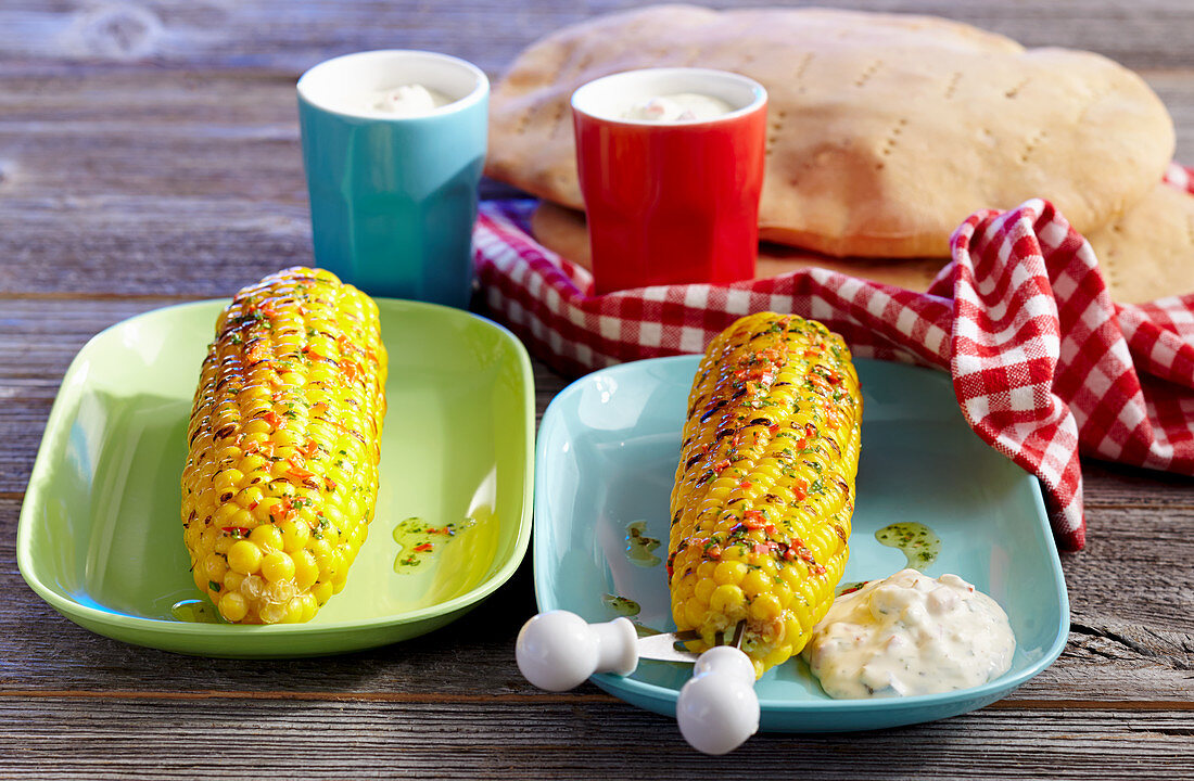 Grilled corn cobs with chilli butter, gorgonzola dip and unleavened bread