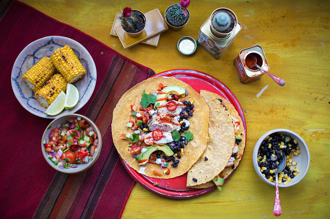 Tortilla with chicken, salsa and corn cobs (Mexico)