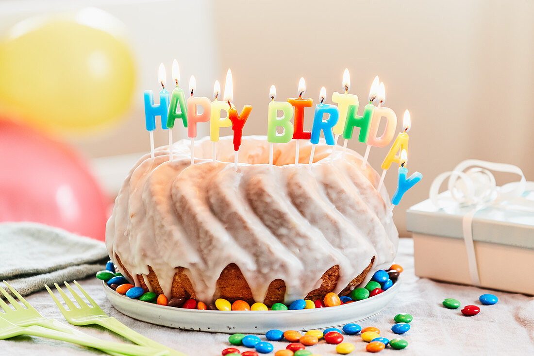 A lemon Bundt cake with birthday candles