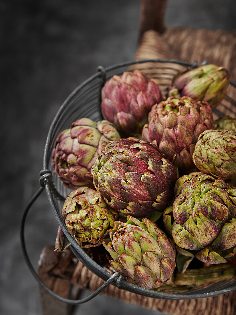 Baby Globe Artichokes on rustic wooden chair