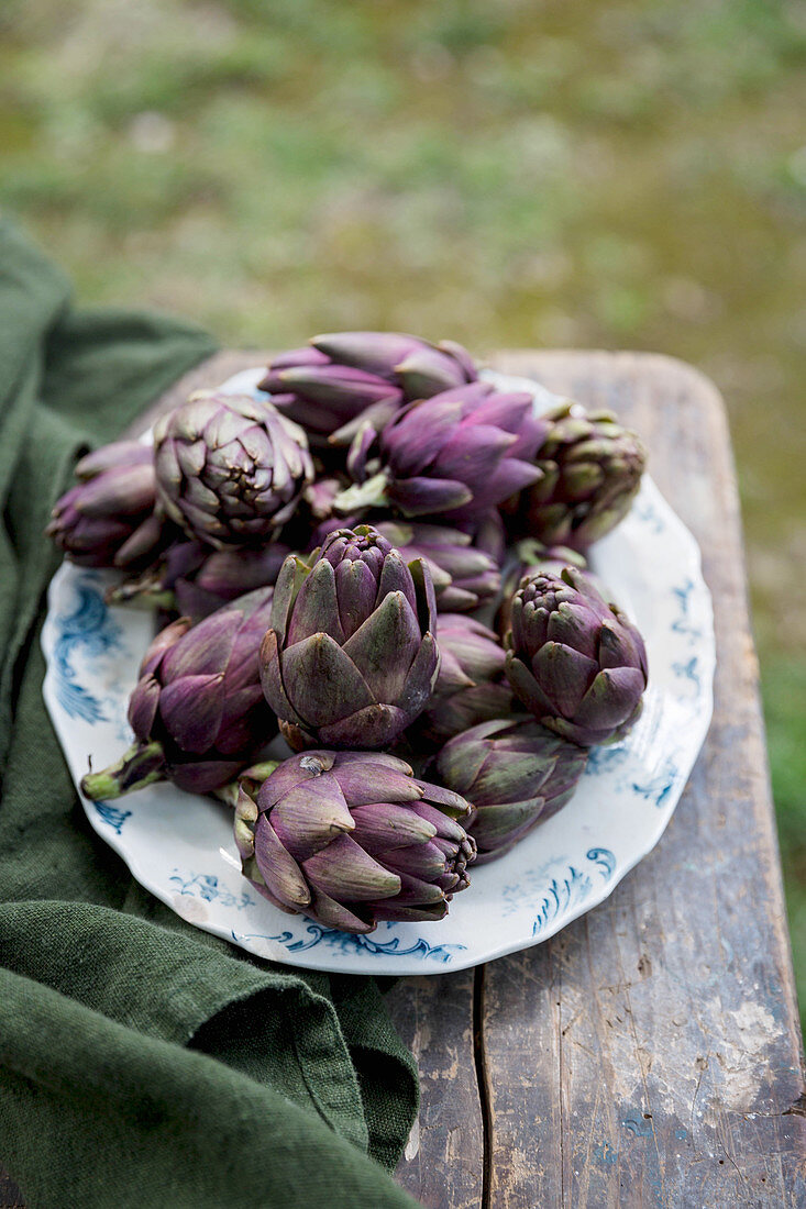 Artichokes on a plate outdoors