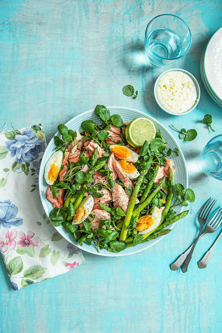 Poached salmon and watercress salad with asparagus and eggs