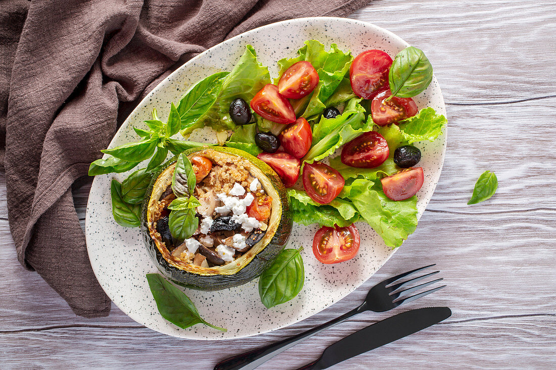 Stuffed roast round zucchini with mushrooms and quinoa