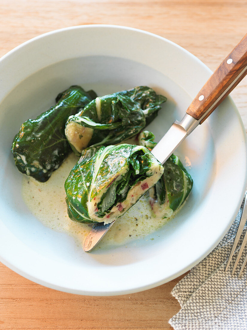 Chard rolls in a cream cheese sauce