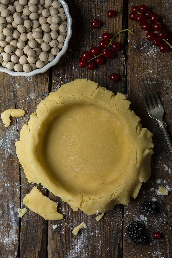 Shortcrust pastry in a tart dish ready for blind baking