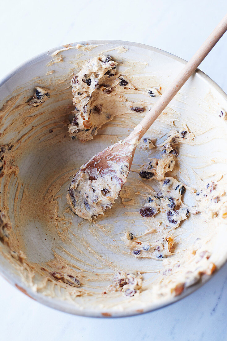 Left-over dried fruit cake in a mixing bowl