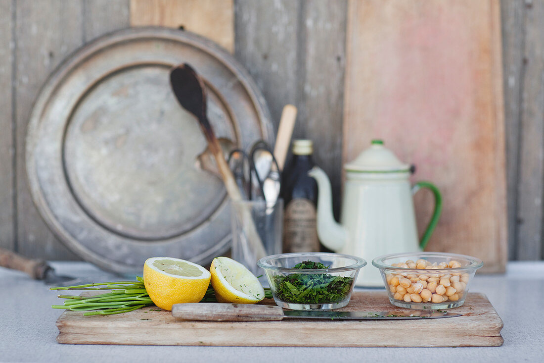 Lemon, parsley and chickpea on chopping board