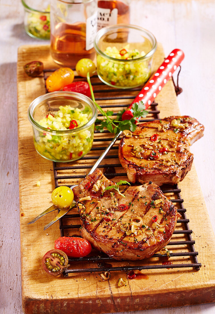 Grilled oriental marinated pork chops with a pineapple and cucumber salsa