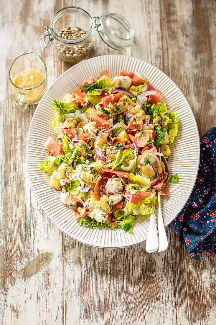 Potato, prosciutto and mozzarella salad with mustard dressing