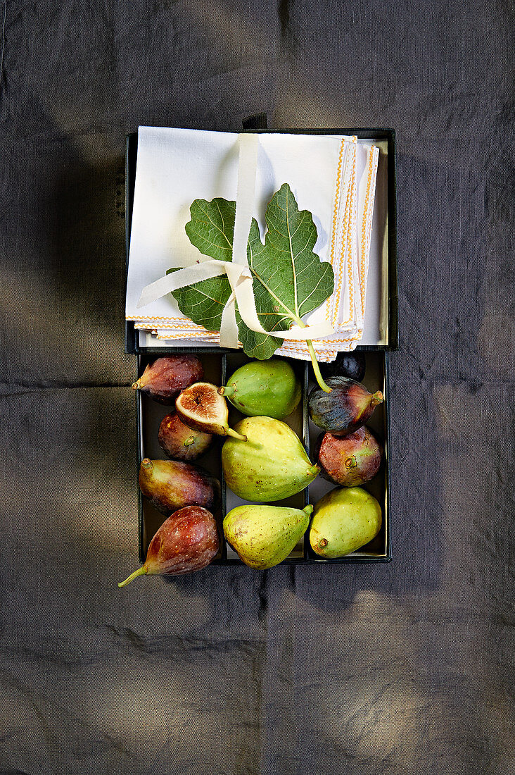 Various fresh figs in a box