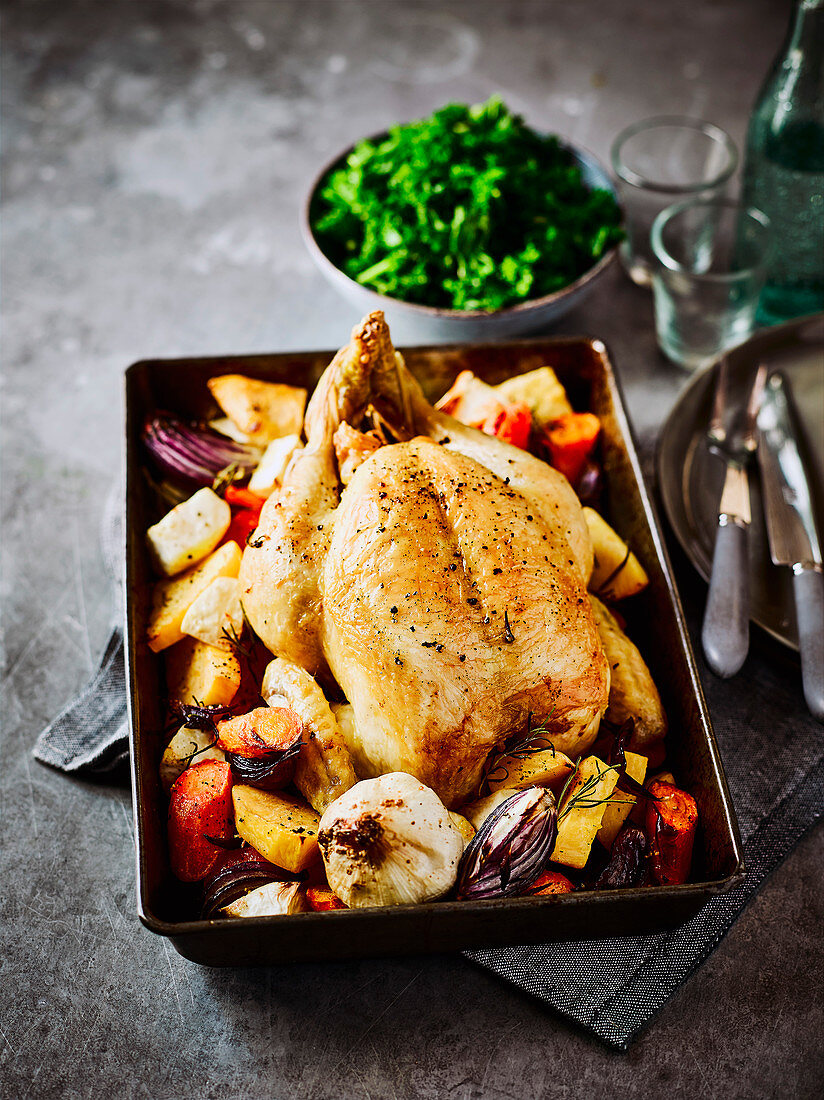 Roast chicken with lemon and rosemary roots