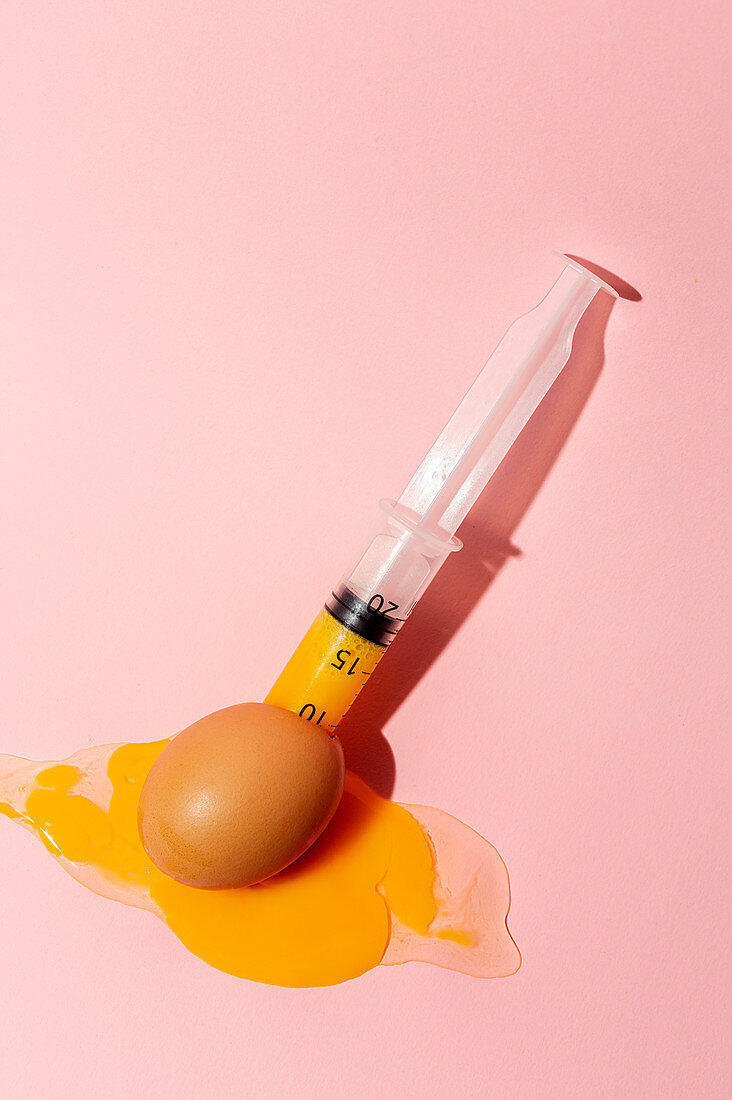 An egg with a syringe