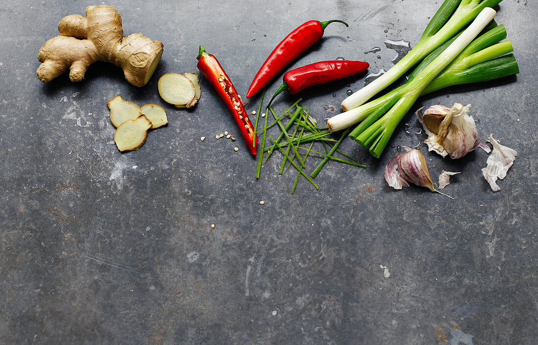 Ingredients for Chinese cuisine on a grey surface