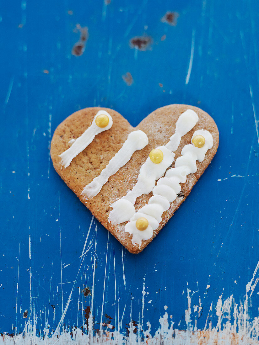 Heart-shaped cookie on blue background