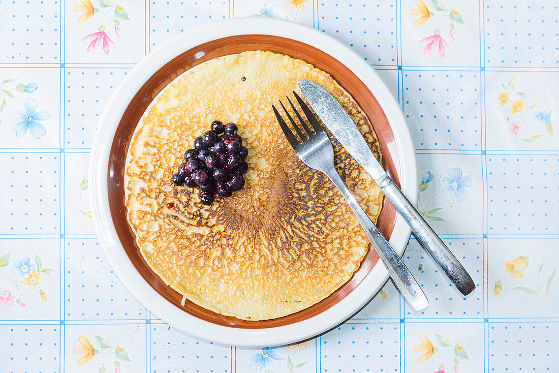 Pancakes with blueberries on a dish