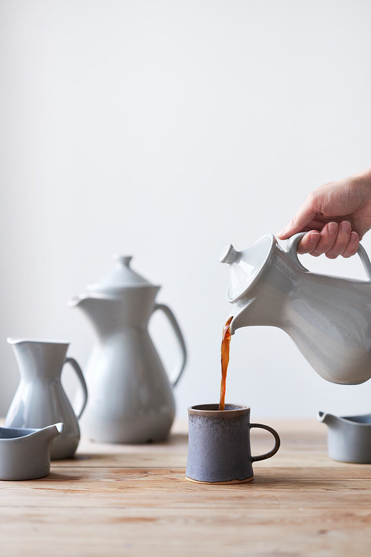 Coffee is poured into mug