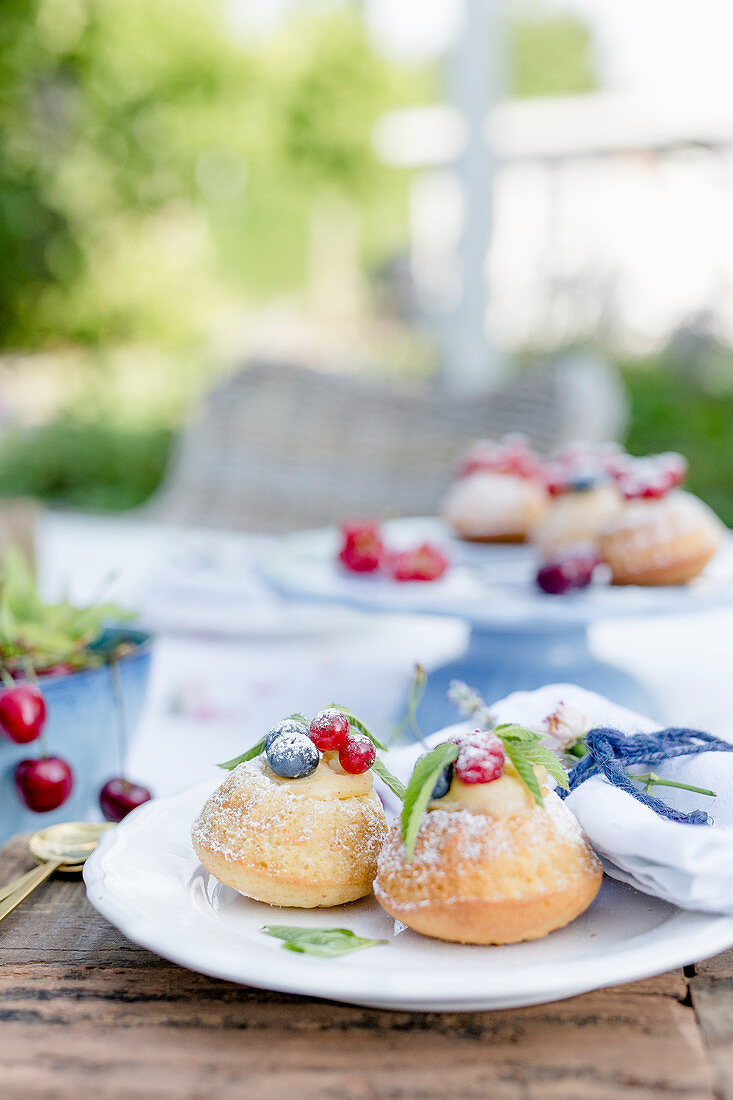 Lemon tartlets with vanilla cream and berries