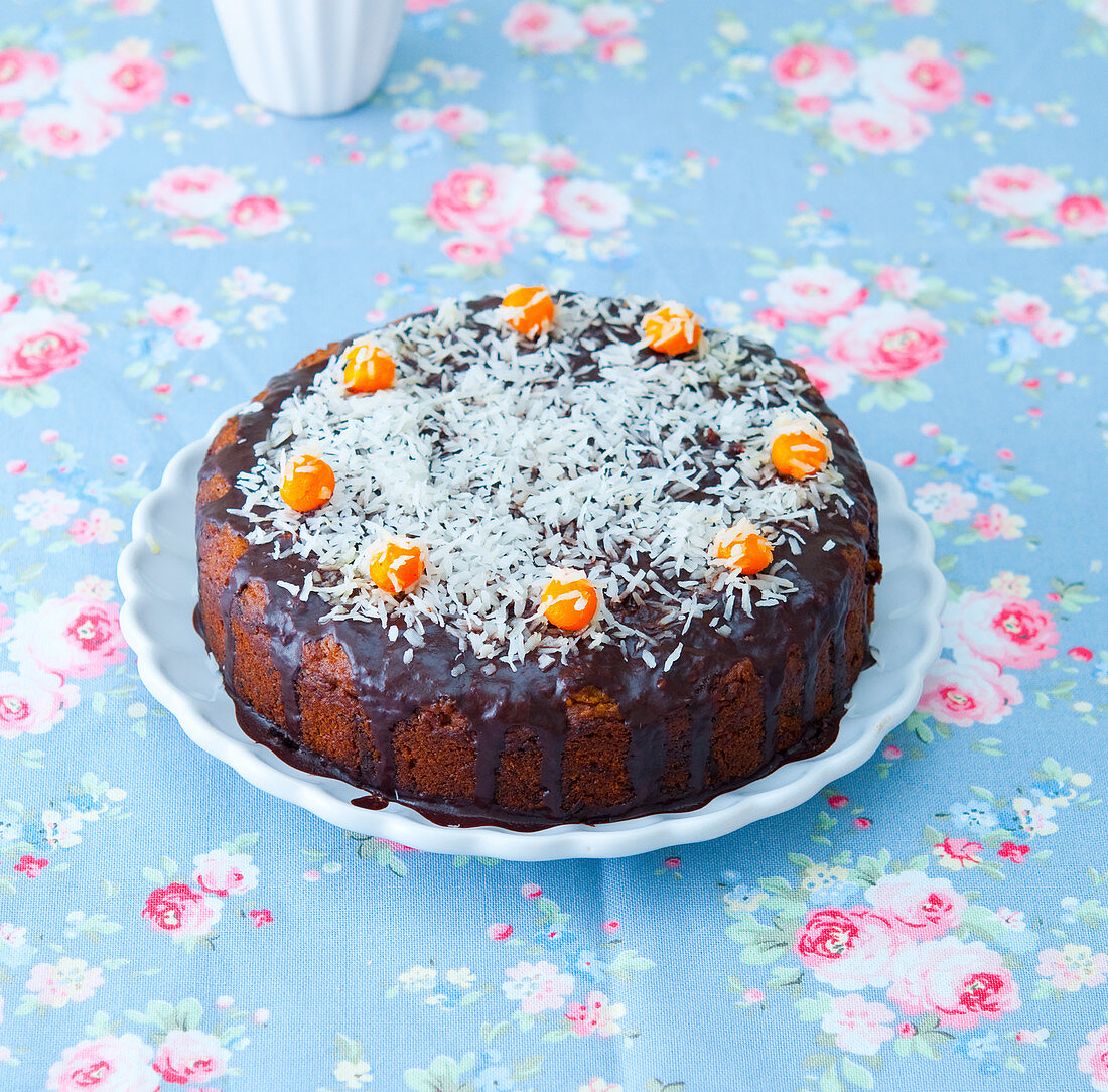 Carrot cake with chocolate icing and grated coconut