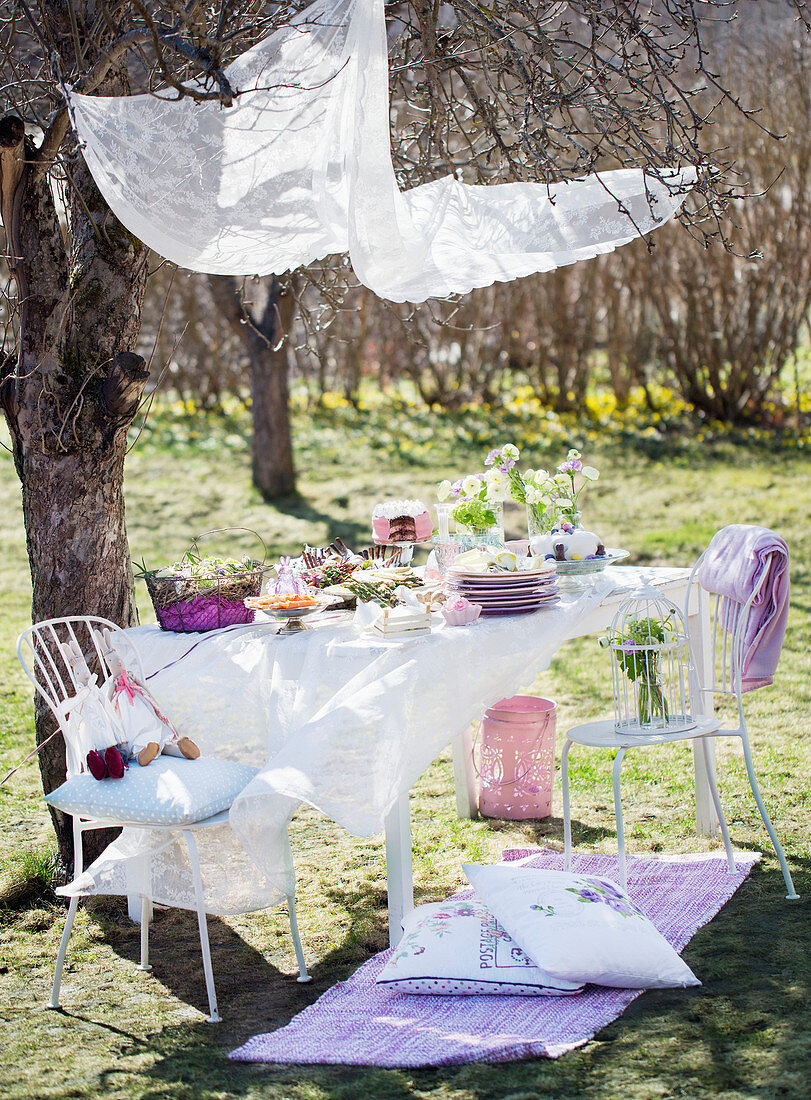A covered easter table in a garden