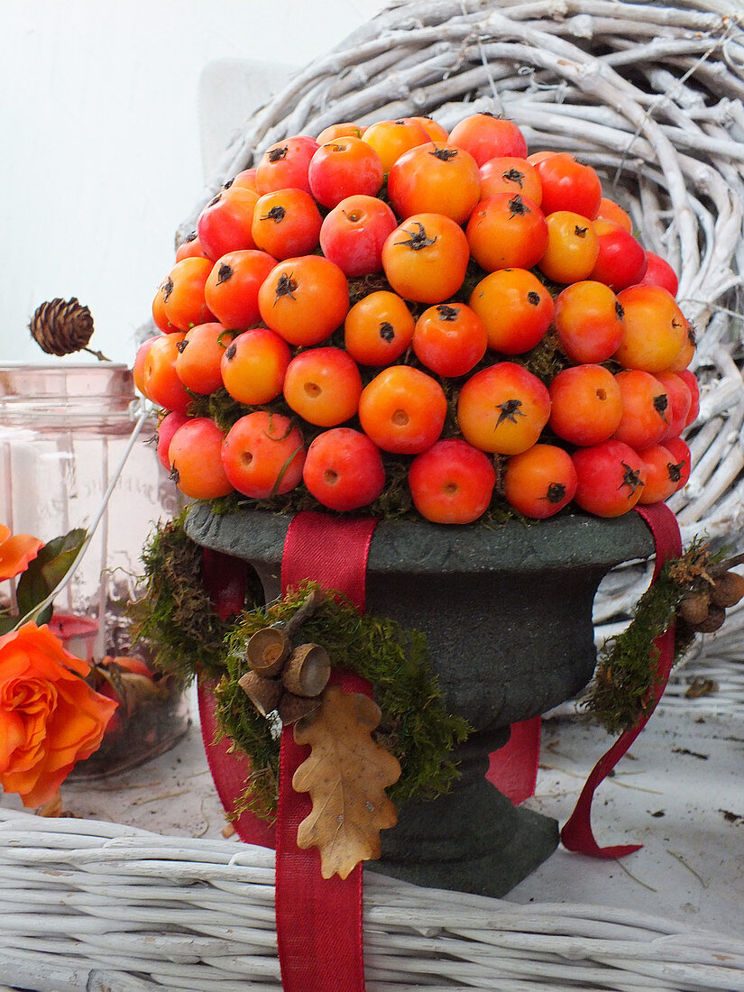 Arrangement of crab apples in urn