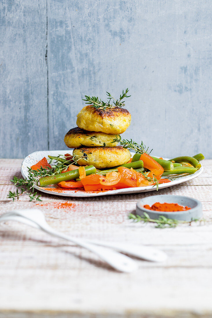 Potato cakes with a pepper medley and green beans