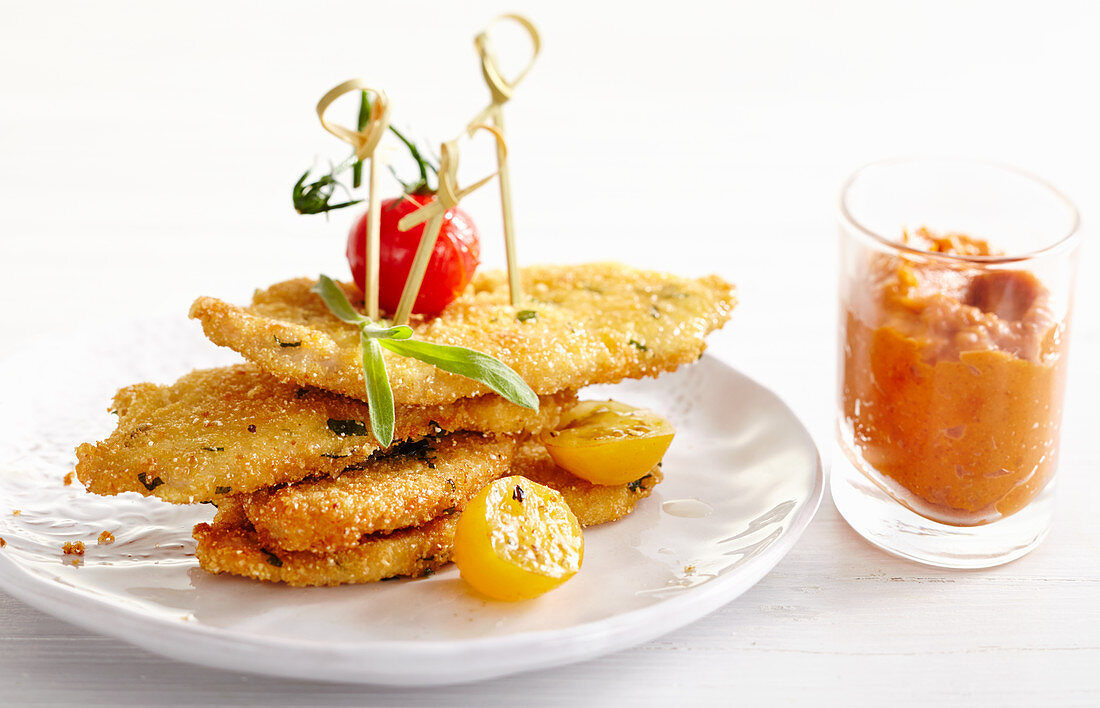 Chicken in crunchy breadcrumbs on skewers with homemade peach ketchup