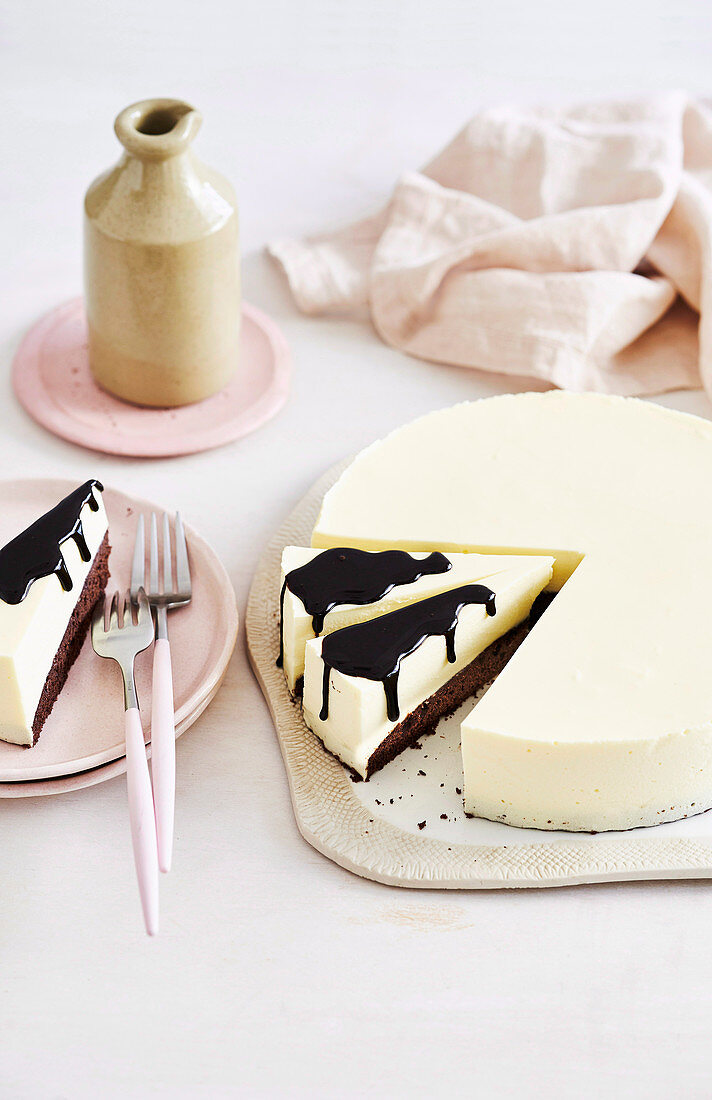 White chocolate mousse cake with dark chocolate sauce