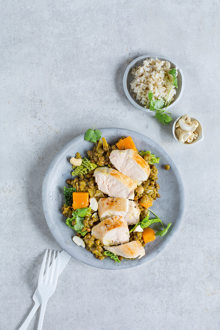 Roast chicken breast with a pumpkin and lentil curry