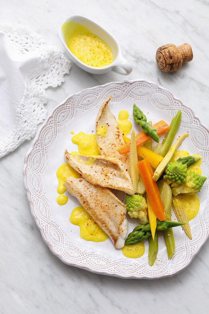 Sole in champagne and saffron sauce with vegetables