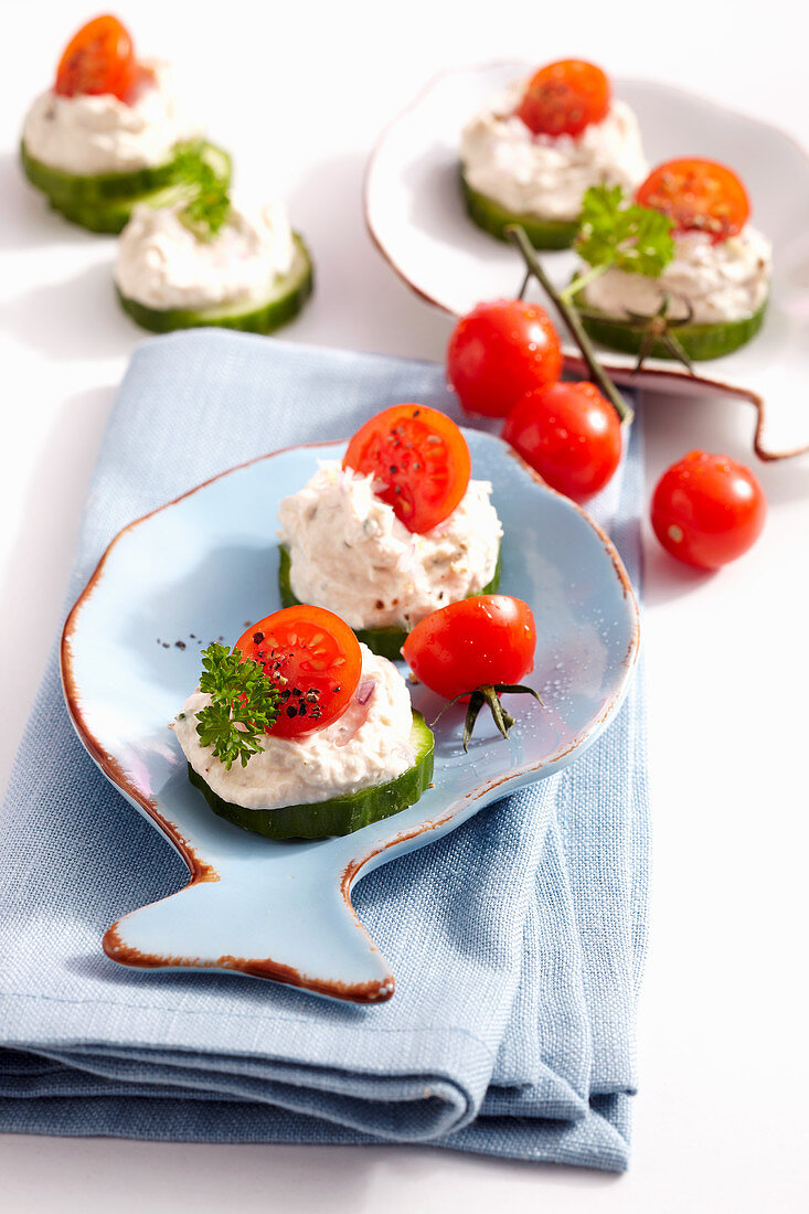 Tuna cream on cucumber slices with cherry tomatoes