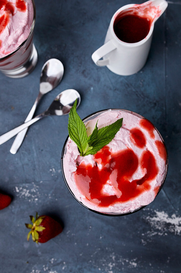 Strawberry mousse in a glass with strawberry sauce