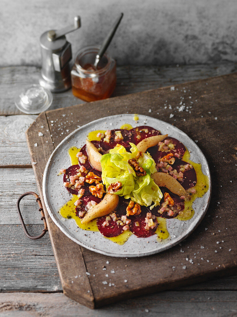 Beetroot carpaccio with walnuts and pears