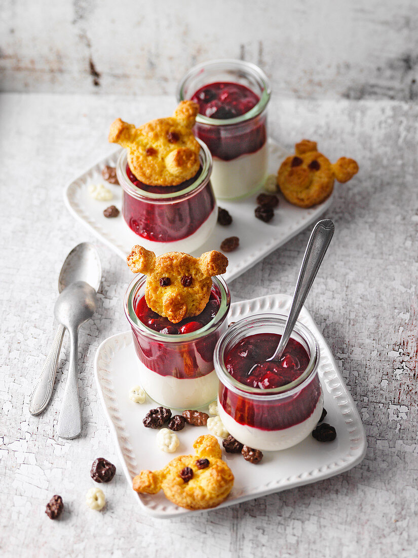 Sour cream with a berry topping and 'pig biscuits'