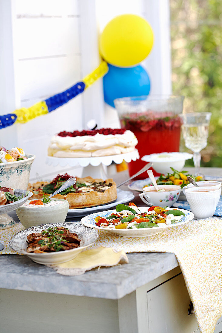 A buffet in front of a house for a garden party