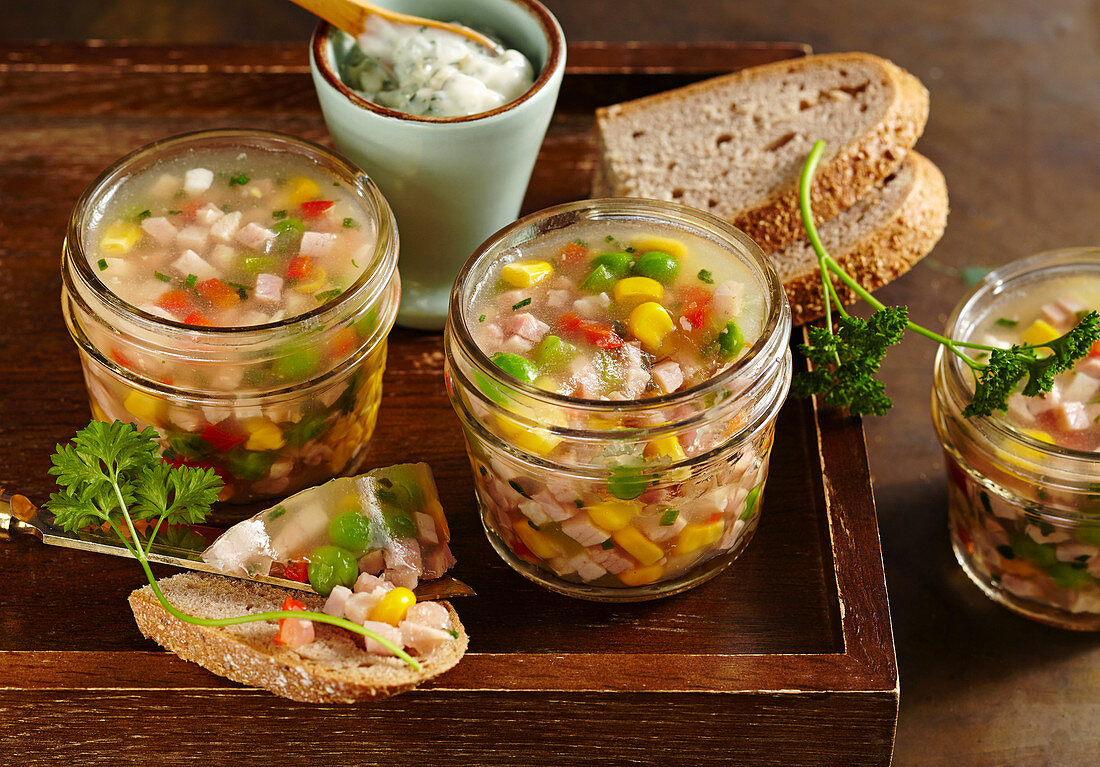 Ham stock in glasses with remoulade and bread