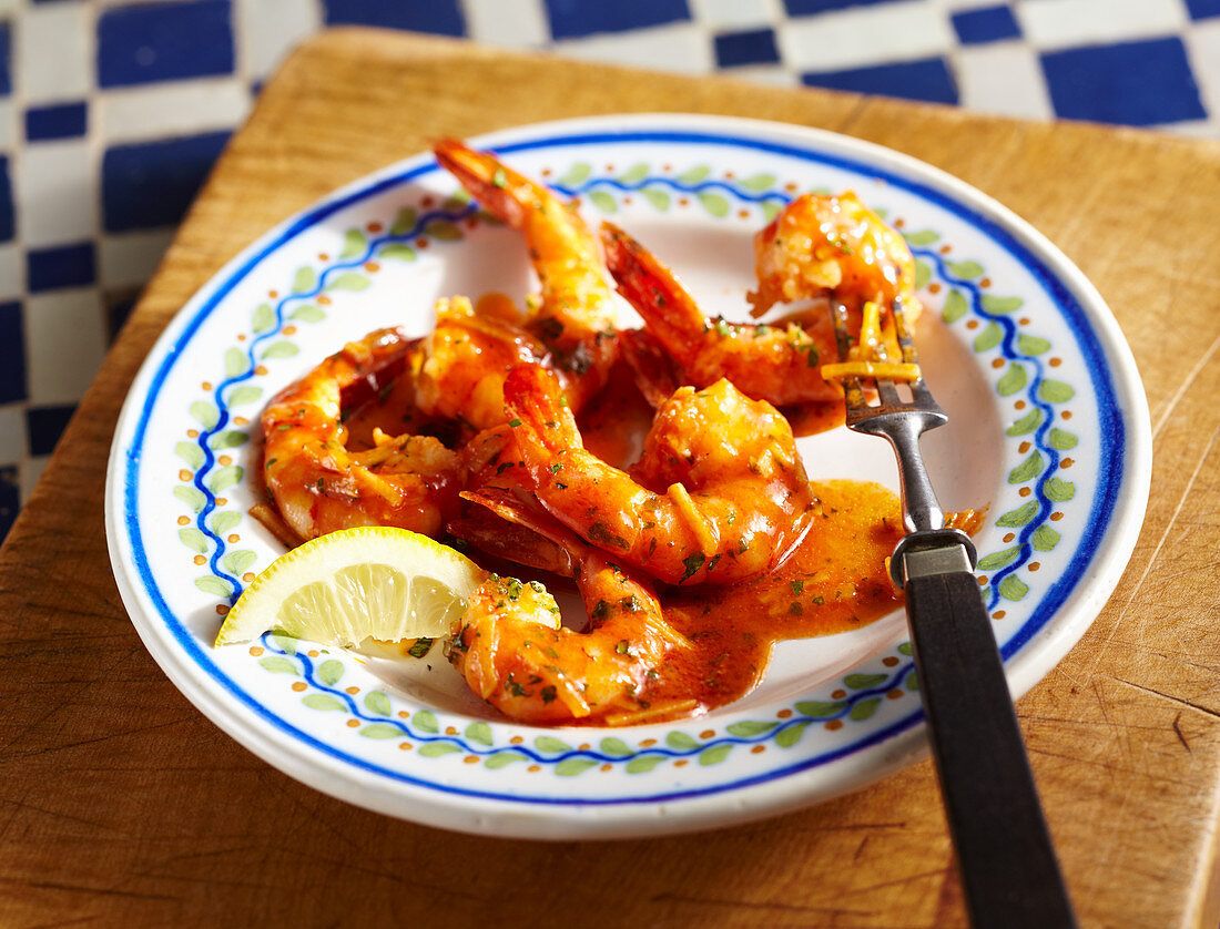 Fried shrimps in garlic and tomato sauce with lemon (Spain)