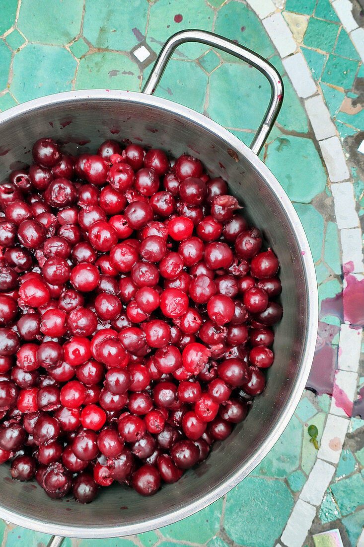 Stoned cherries in a pot