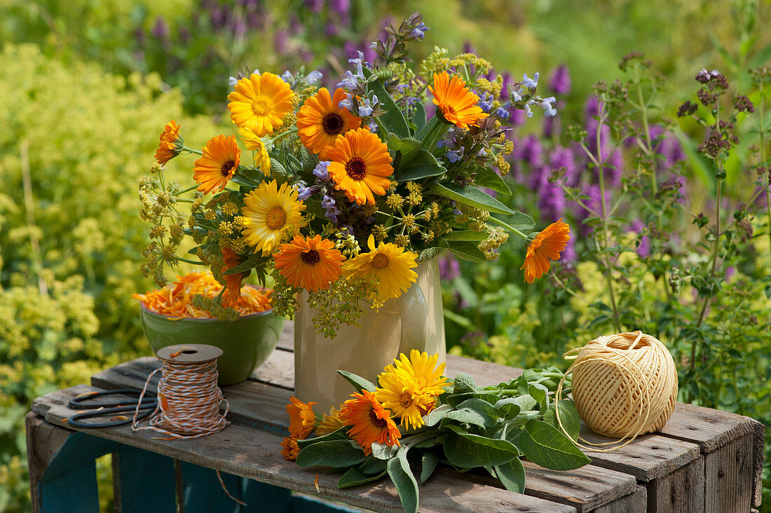 Summer bouquet of marigolds, sage, and fennel flowers