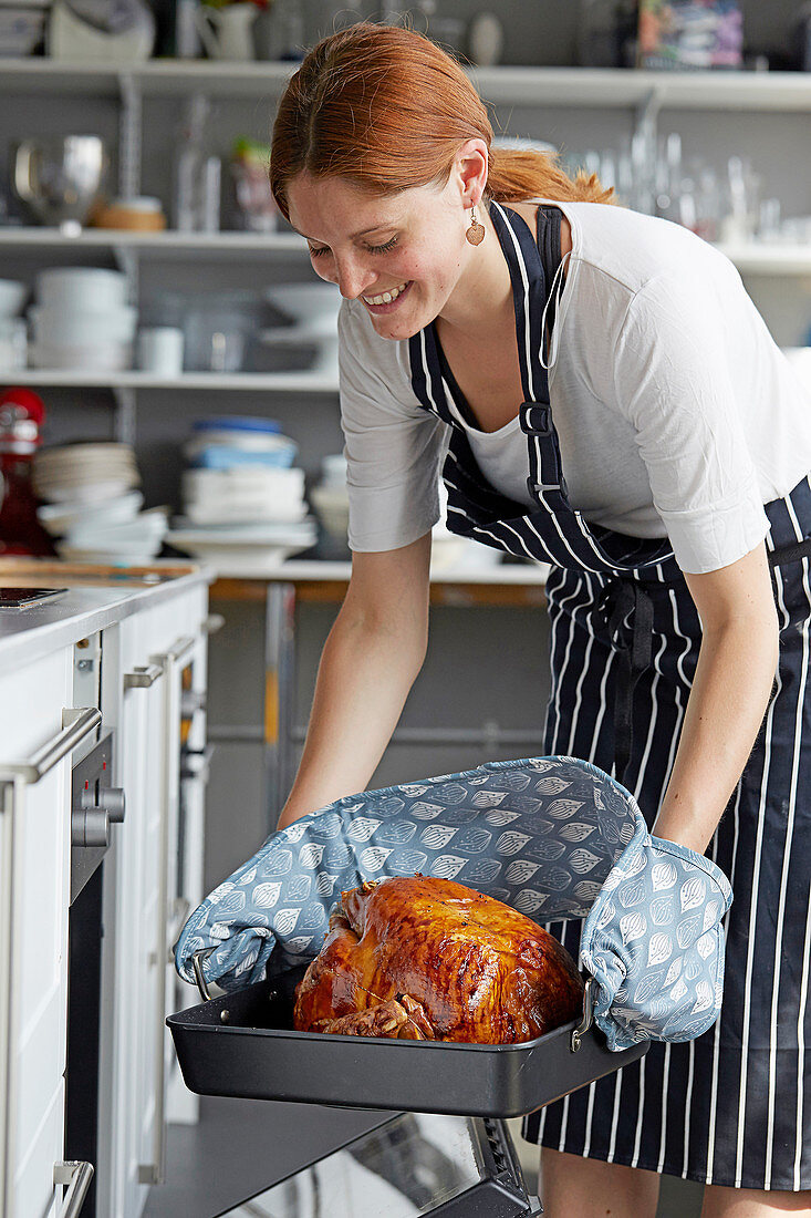 Takin turkey from the oven