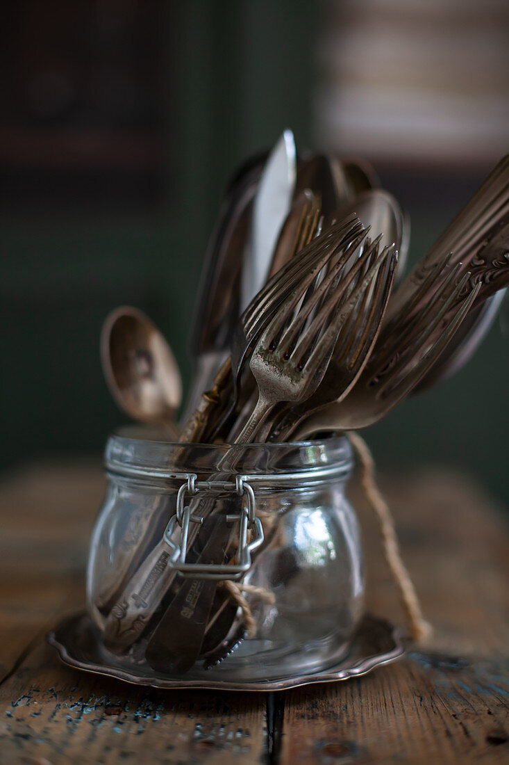 Vintage cutlery in jar
