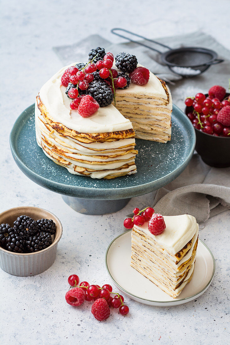 A pancake cake with lime cream and berries (low carb)